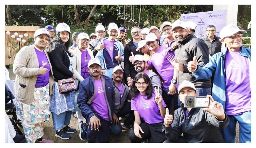 Mishra Foundation volunteers and participants in purple t-shirts celebrating together at The Purple Walk