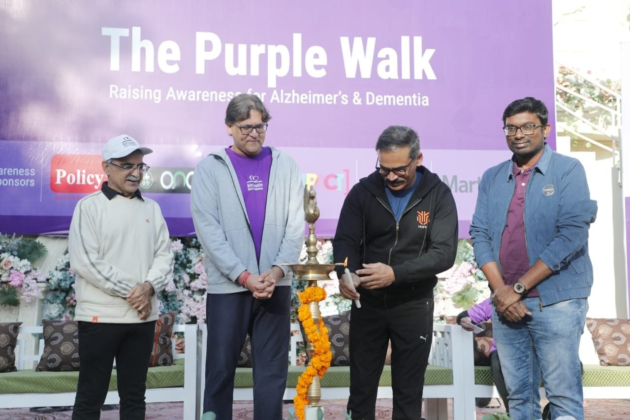 Elderly participants of The Purple Walk seated together at a Mishra Foundation dementia awareness event